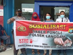Polsek Langgam Sosialisasikan Saber Pungli, Sambangi Keramaian Masyarakat